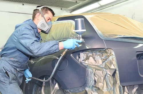 How to apply a solvent-based two-coat paint on a car?